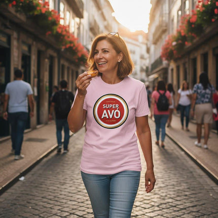 Woman walking down a street eating a pastel de nata, wearing a pink t-shirt with 'Super Avó' design.